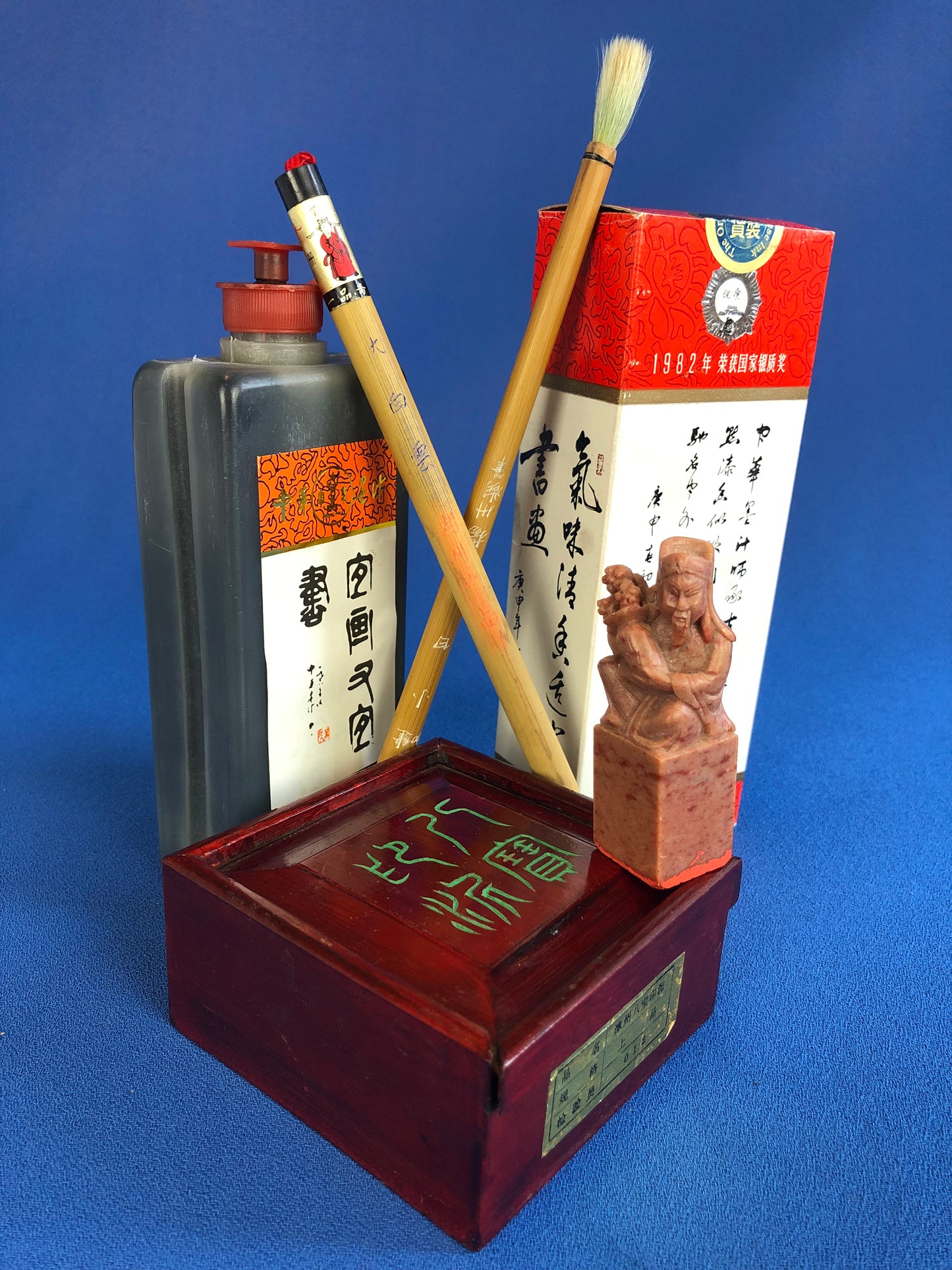 chinese calligraphy kit: ink, brushes and stamp
