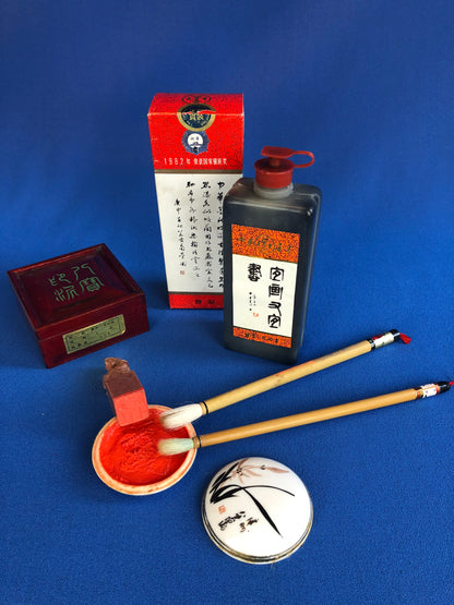 chinese calligraphy kit: ink, brushes and stamp