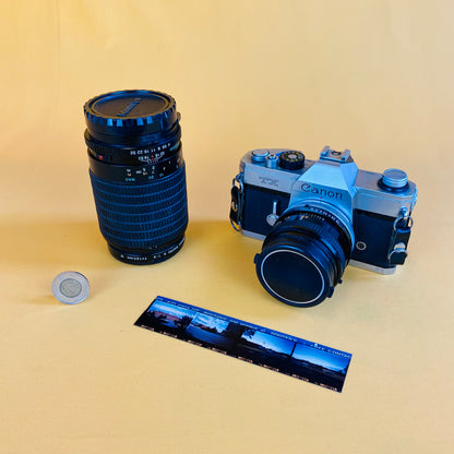 canon film camera and two lenses