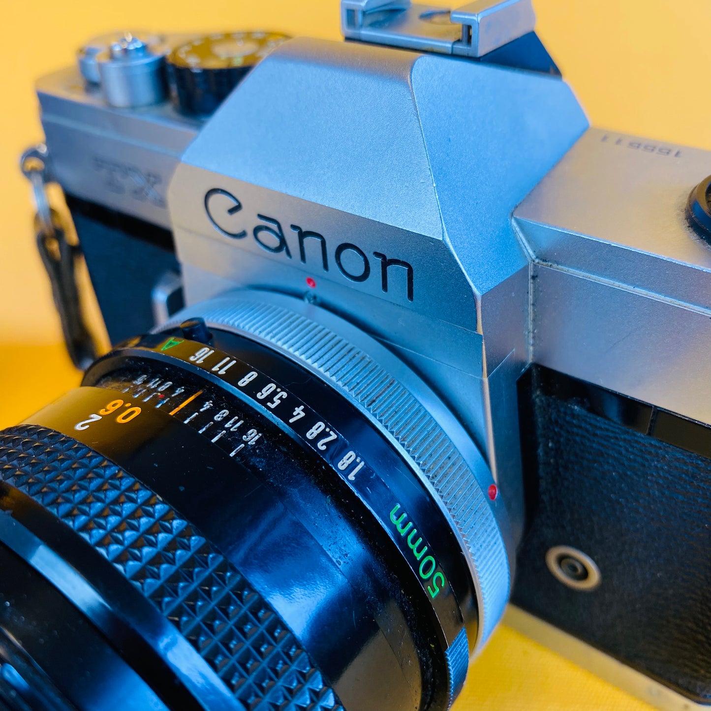 canon film camera and two lenses