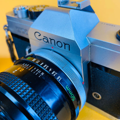canon film camera and two lenses